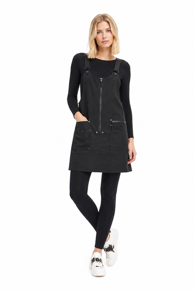 Model wearing the BLACKPANTS Essential Layering Top underneath the BLACKPANTS Industrial Pinny, showcasing its streamlined fit and layering versatility