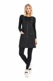 Model wearing the BLACKPANTS Essential Layering Top underneath the BLACKPANTS Industrial Pinny, showcasing its streamlined fit and layering versatility