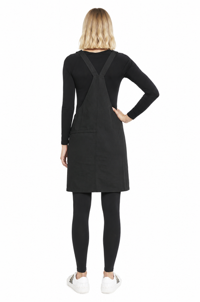 Back view of BLACKPANTS Pinny apron dress showing crossover straps and relaxed fit